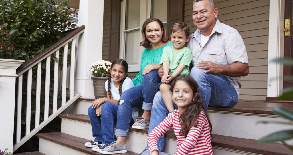 Family in front of home