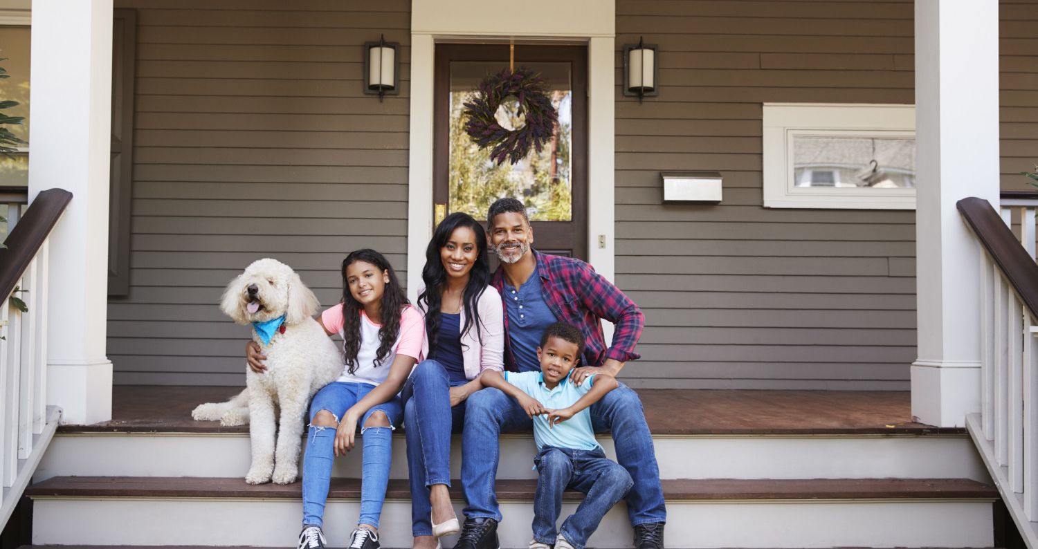 Family in front of their home