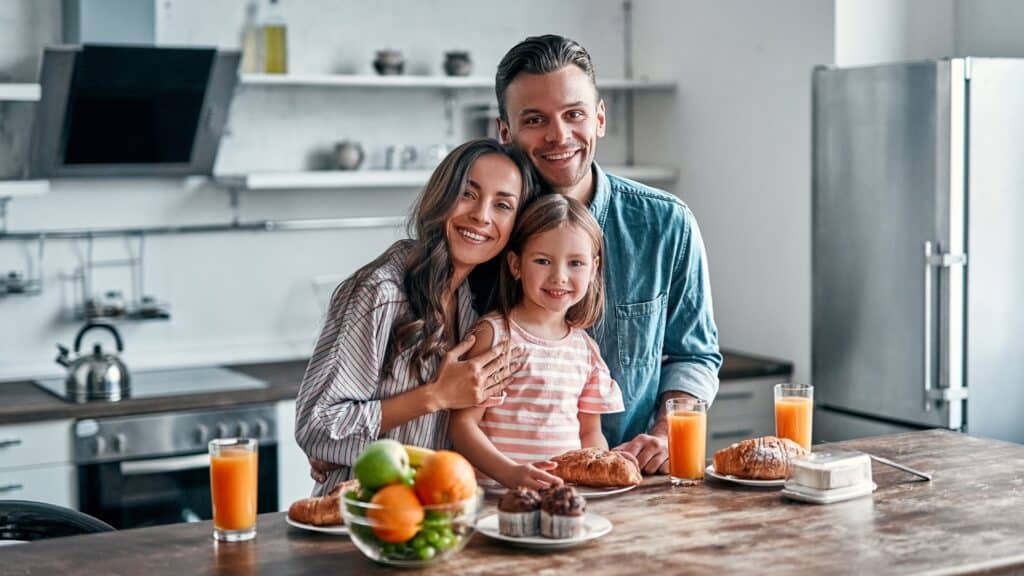 Family eating in their home after their kitchen remodel is complete.