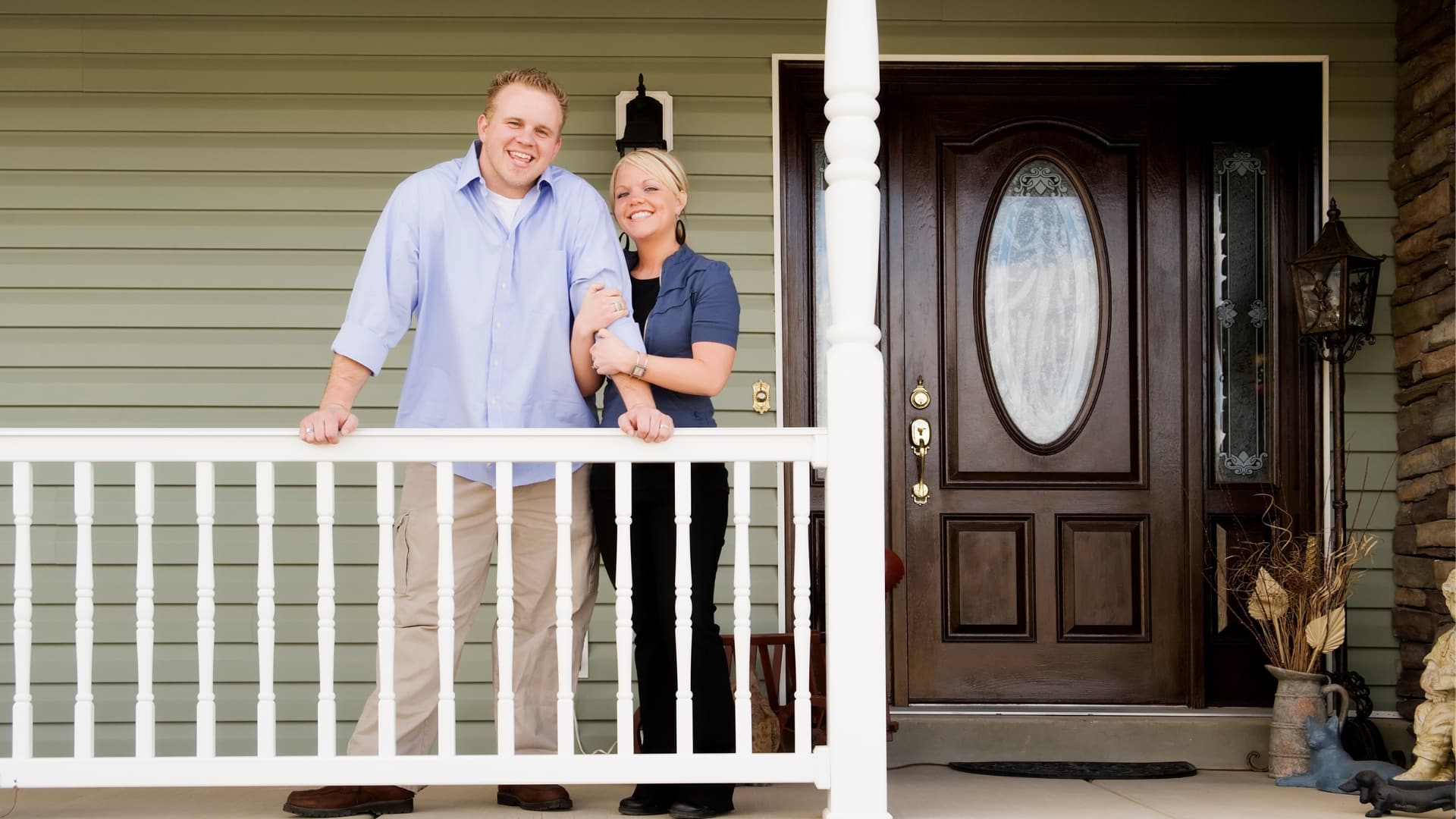 First-time homebuyers on their porch