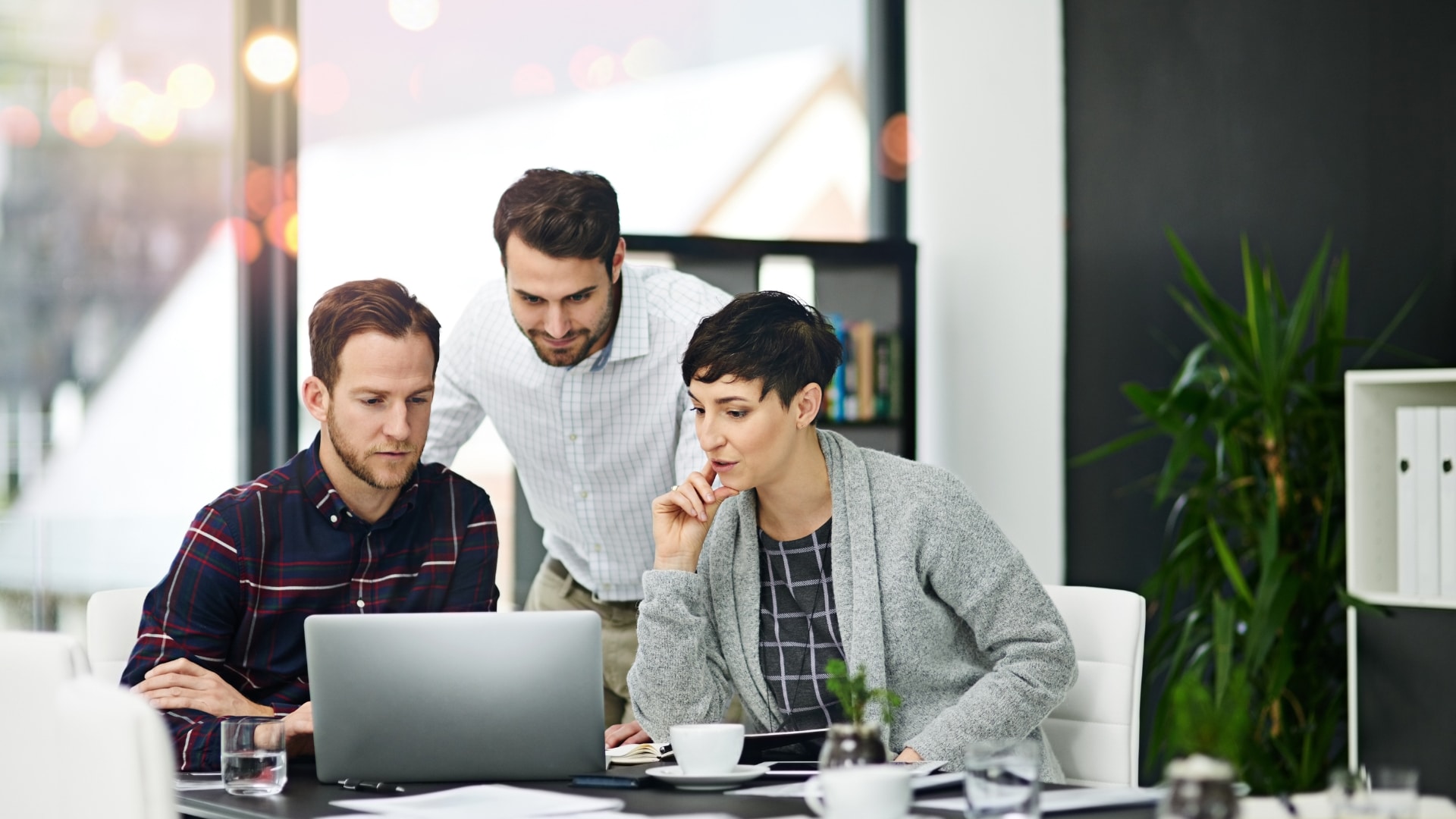 Loan officer and couple reviewing documents